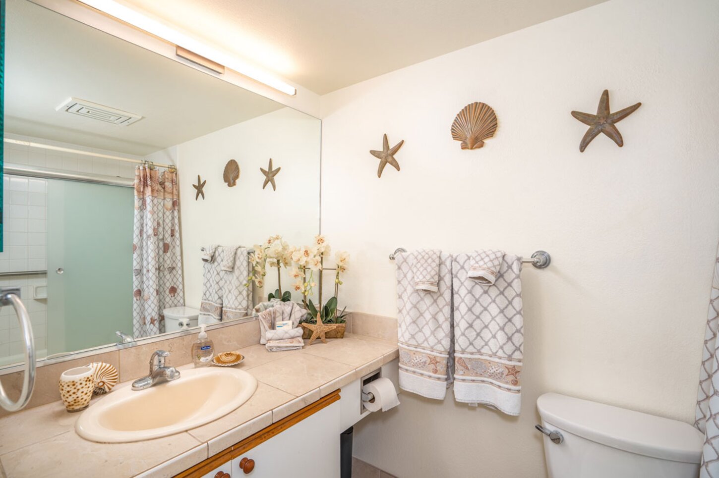 Master bathroom with Tiled counter top and flooring