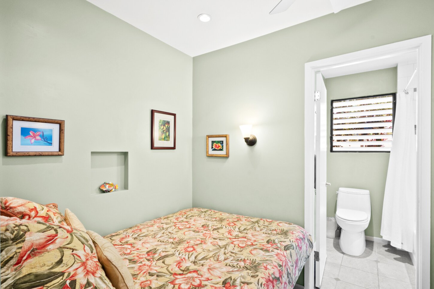 Queen bed in secondary sleep area, next to hall bathroom and washer/dryer combo.