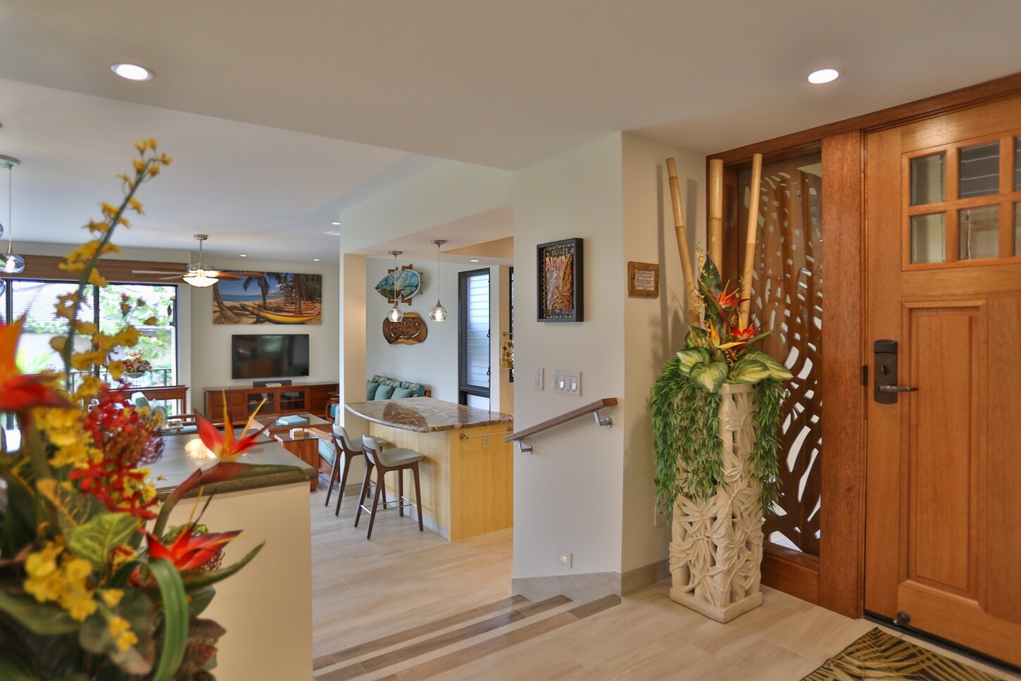 Our home has tropical furnishings and porcelain plank tile flooring throughout