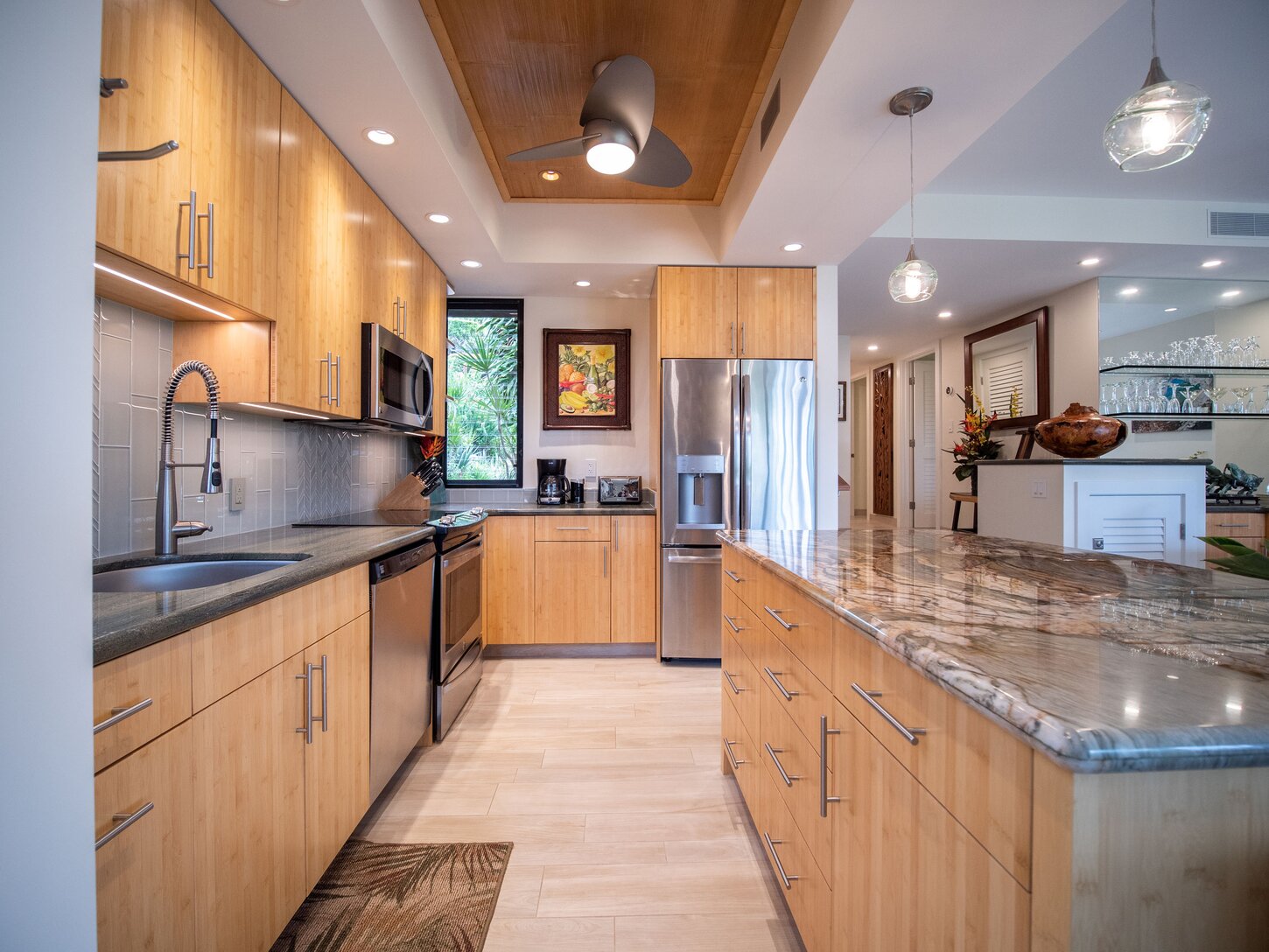 Kitchen features new stainless steel appliances and gourmet furnishings