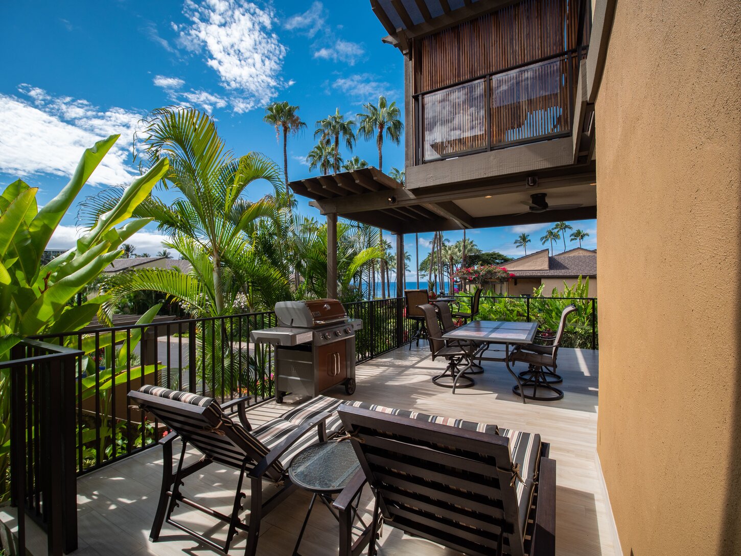 Lanai features chaise lounges and a large dining table