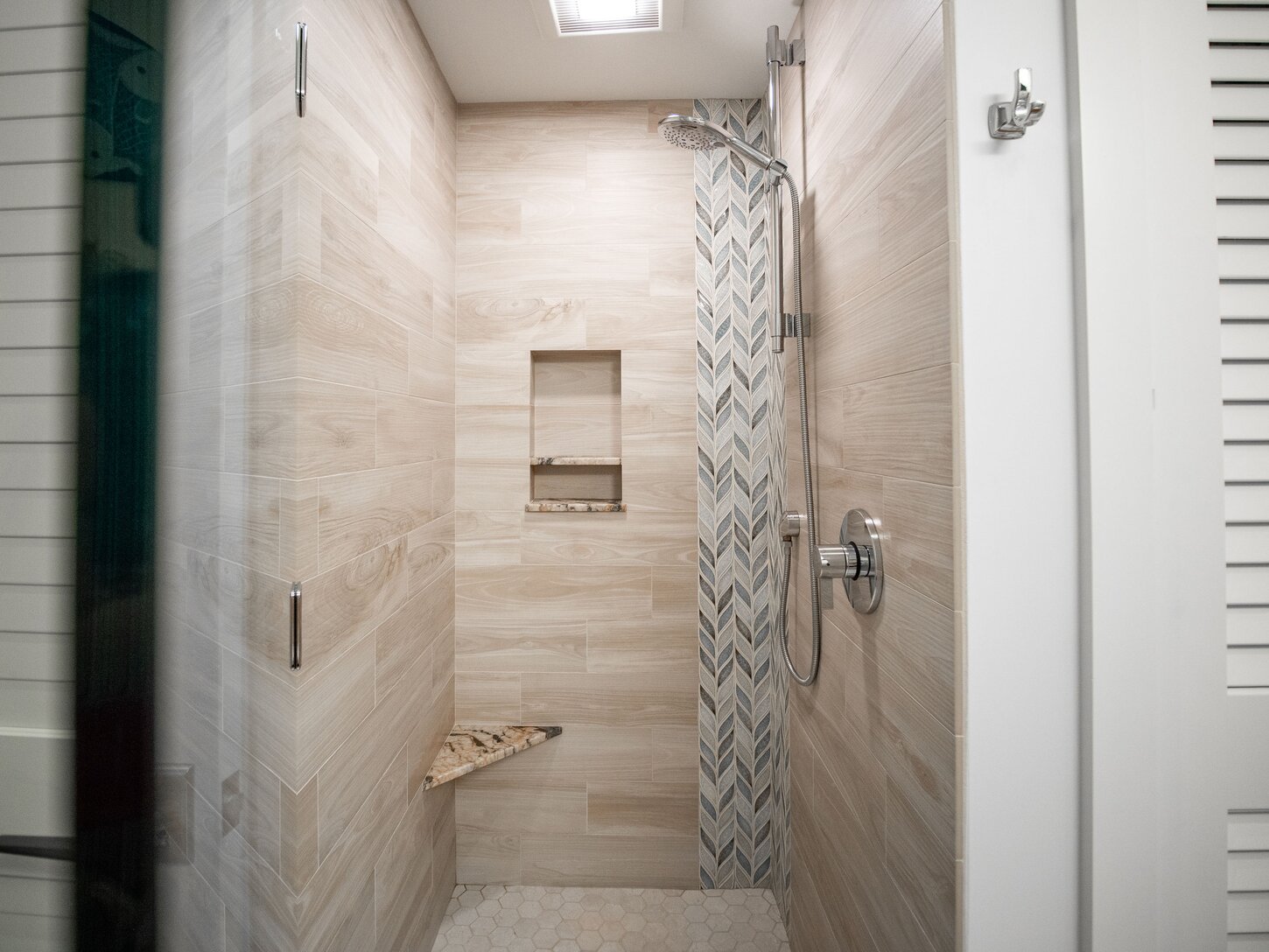 Guest bathroom shower features Hansgrohe fixtures