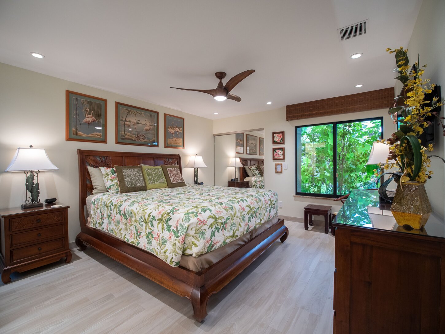Luxury master bedroom suite features hand carved, solid mahogany furnishings