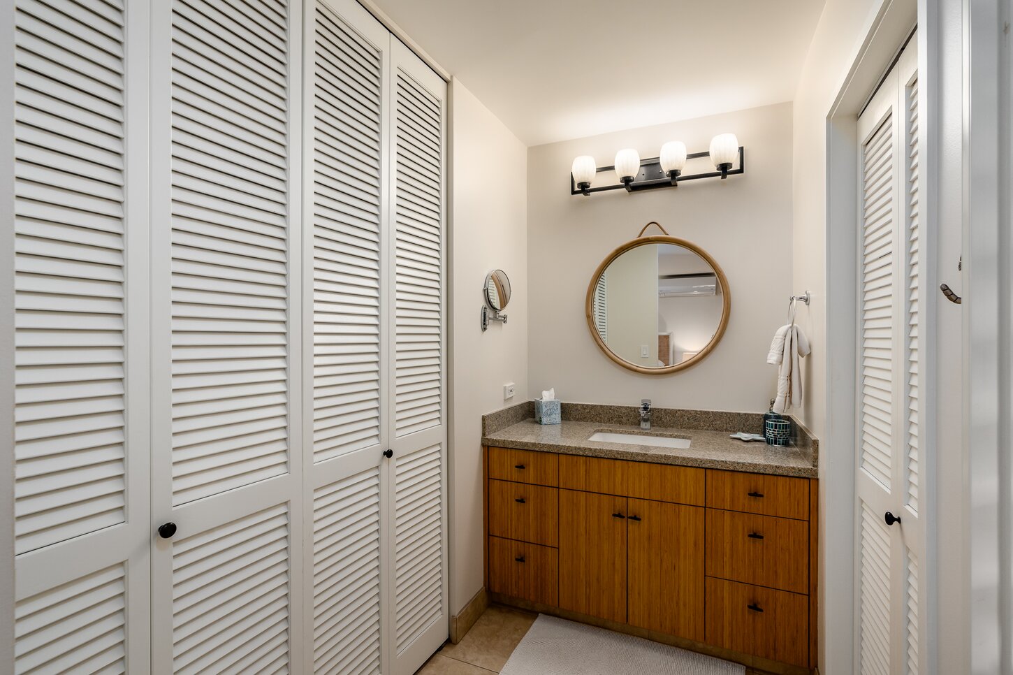 The primary bath has a large linen and hanging closet.