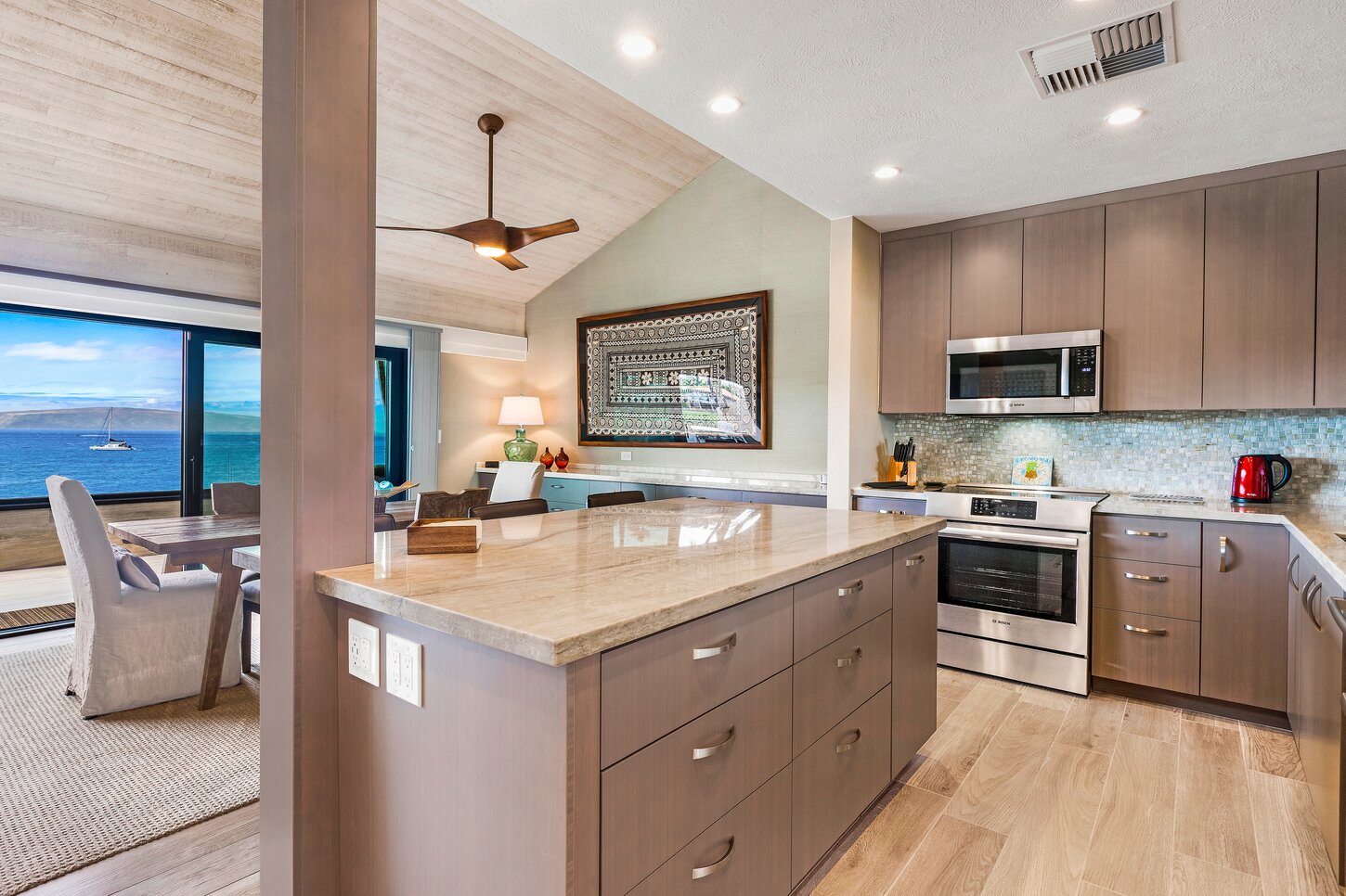 Kitchen with large quartzite island.