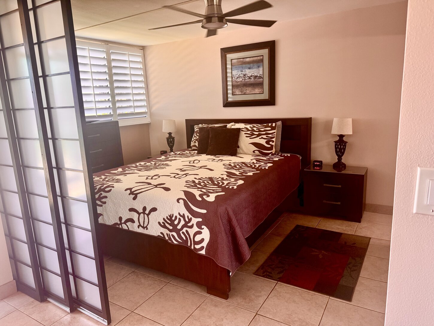 Primary bedroom showing shoji doors