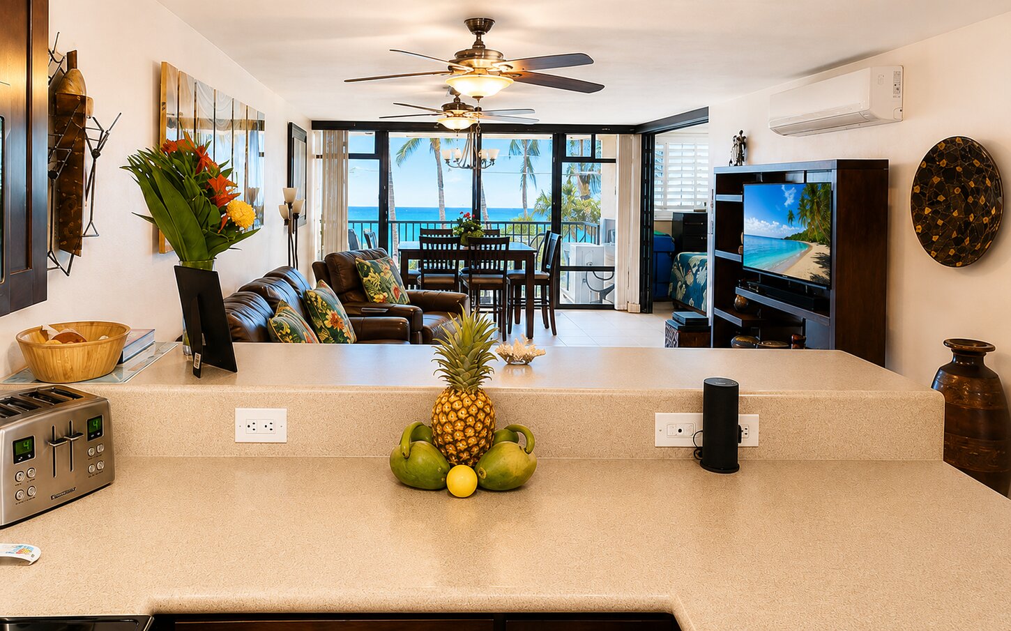Kitchen view of living room, dining room and beautiful grounds/oceans