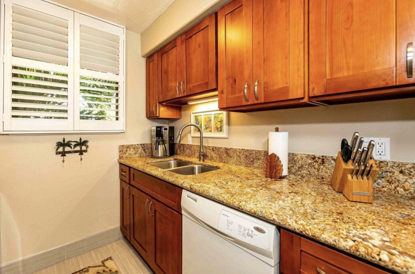 Fully stocked kitchen with dishes, cookwares, utensils, blender, coffee pots