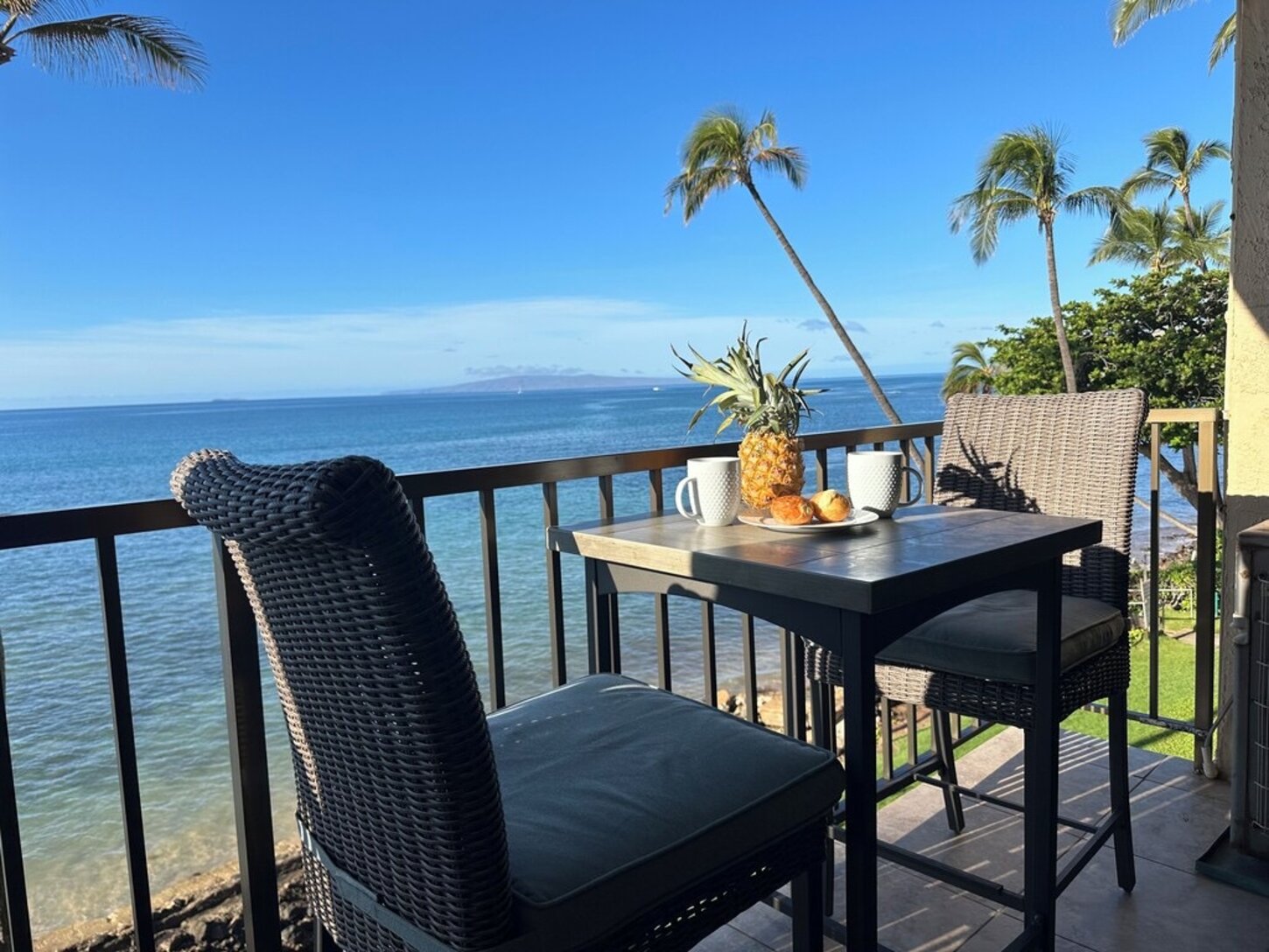 Comfortable lanai furniture for relaxing or dining with the view