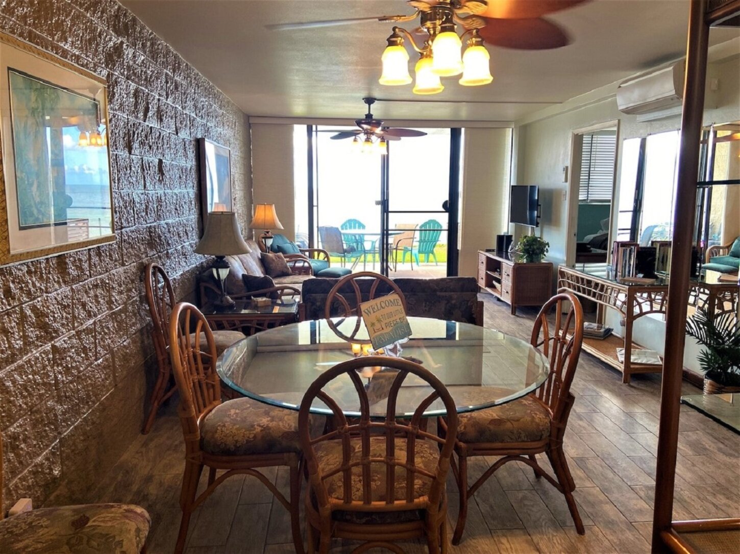 A nice view of the living room, all the way out to the ocean from the kitchen.
