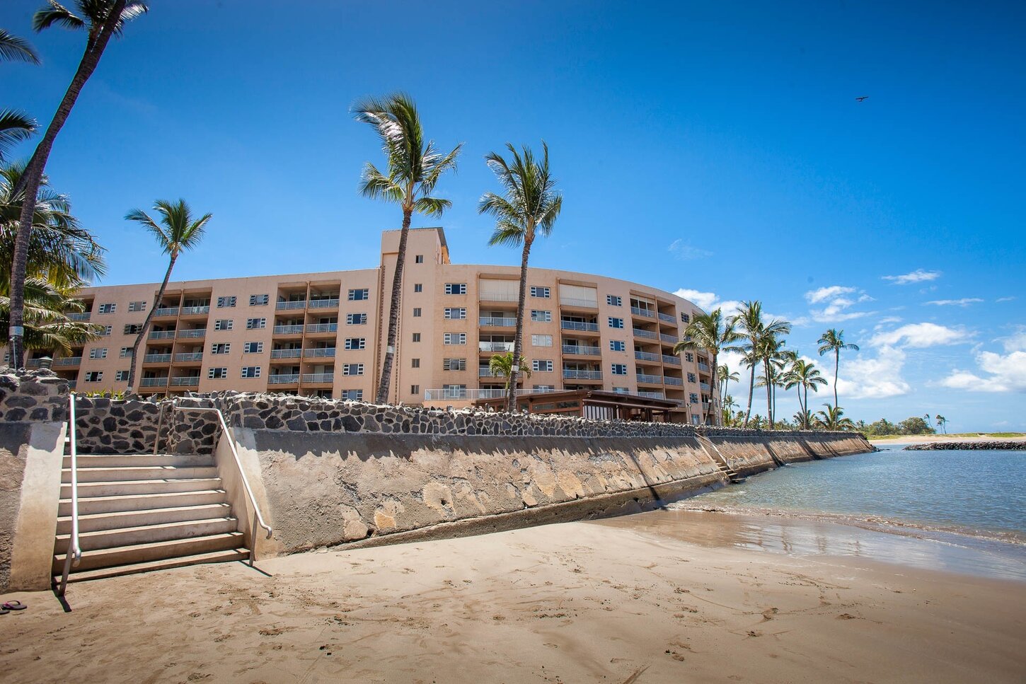 Beachfront with building  at low tide