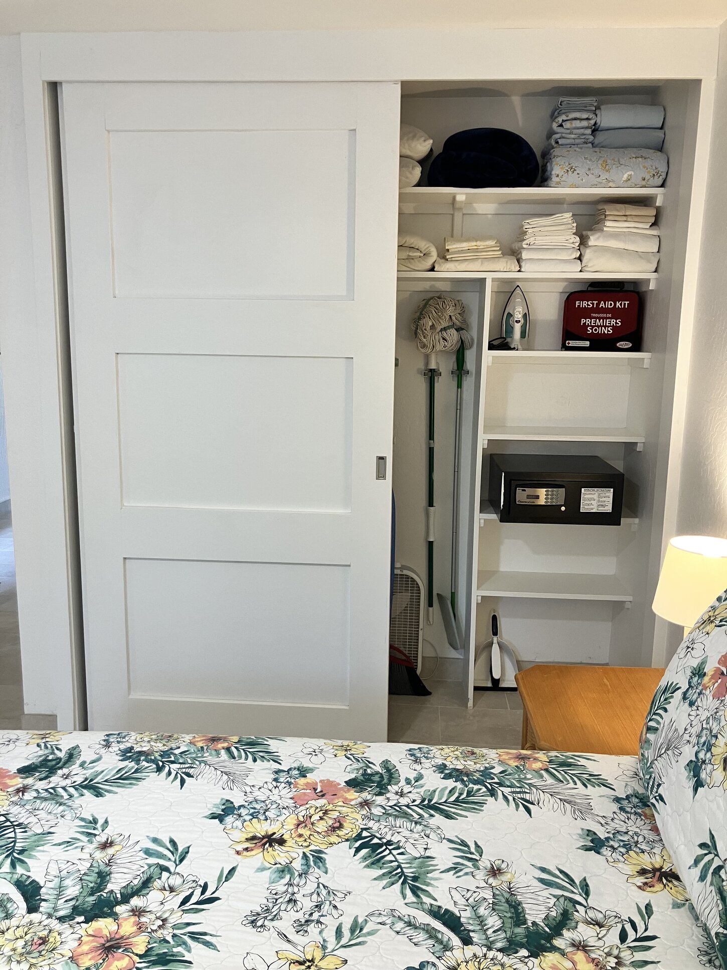 More closet space with spare sheets, blankets and a safe