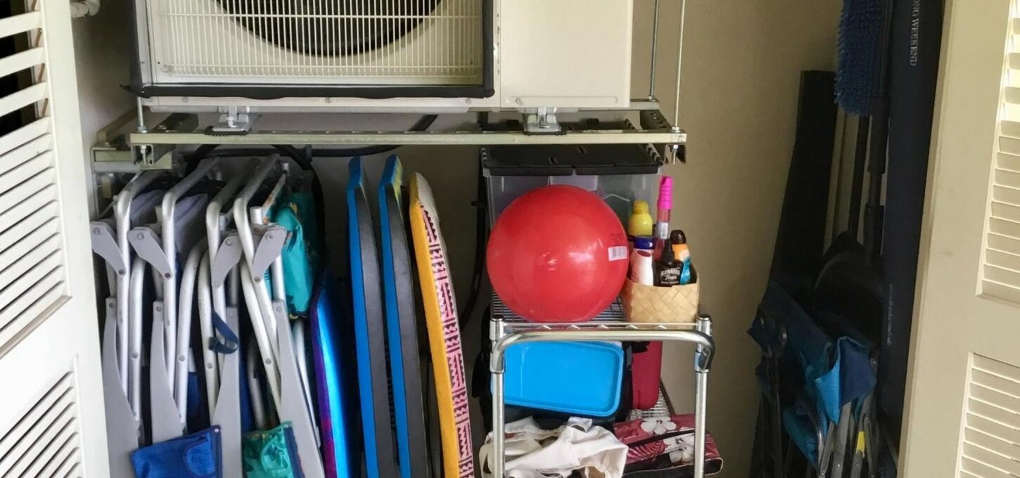 Lanai closet, air conditioner, beach chairs, umbrella. ice chests, wagon and toys.