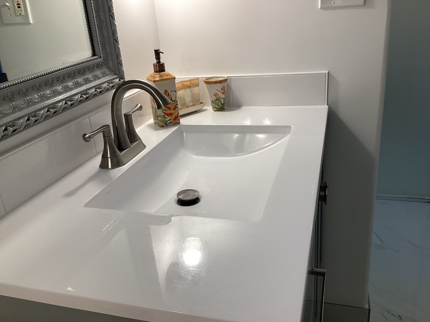 Marble sinks and Carrara tiles in both bathrooms 