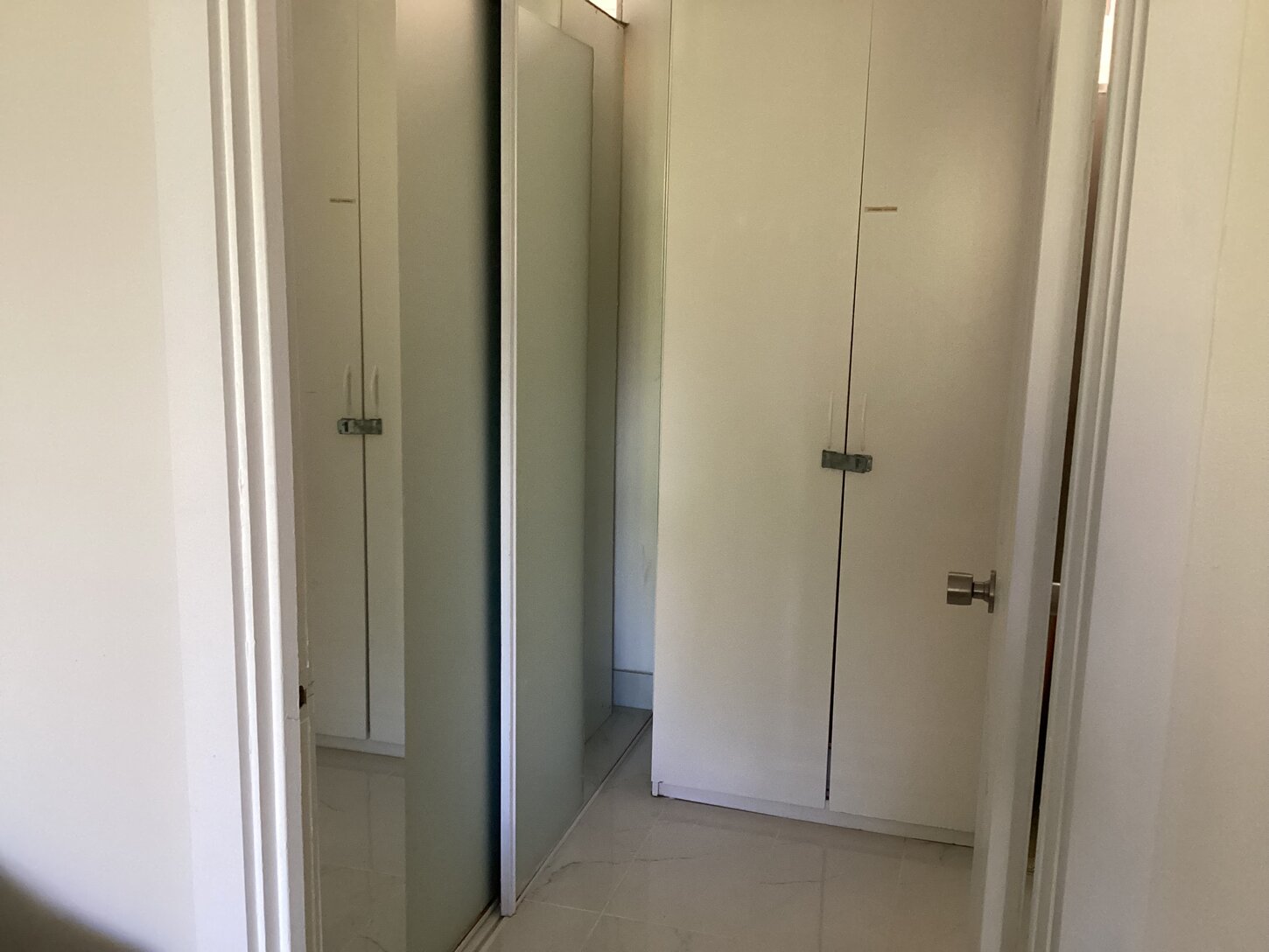 Closet, Linens and Entrance to Pimary Bathroom 