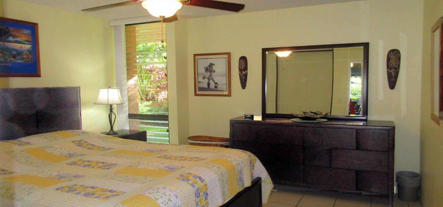 Bedroom with queen bed and ceiling fan